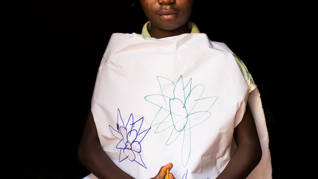 Maimouna poses dressed up as a nurse, in Carnot, Central African Republic.
Only the organization Doctors Without Borders brings health care to the displaced families living within the enclave.