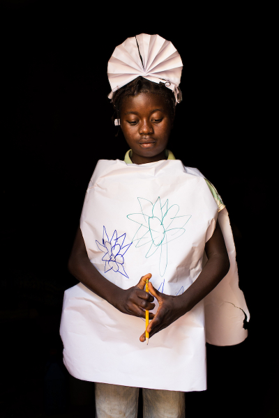 Maimouna poses dressed up as a nurse, in Carnot, Central African Republic.
Only the organization Doctors Without Borders brings health care to the displaced families living within the enclave.